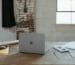 a laptop computer sitting on top of a wooden table